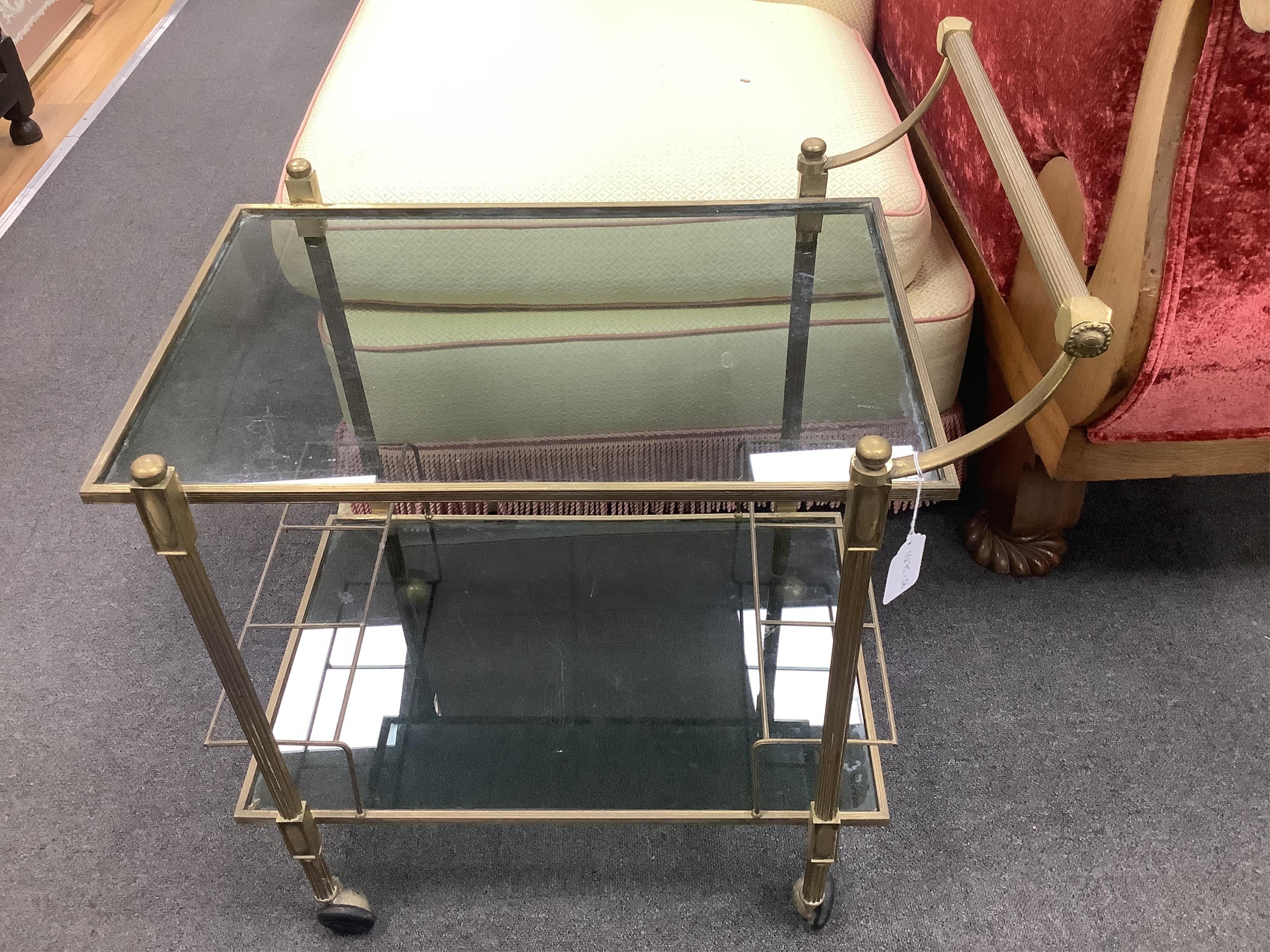 A brass two tier drinks trolley, width 44cm, depth 64cm, height 72cm. Condition - fair